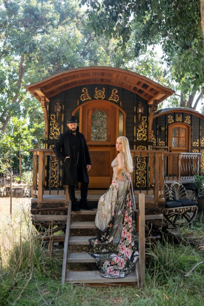 Peaky Blinders inspired engagement shoot of bride and groom outside a Malibu mountain gypsy caravan