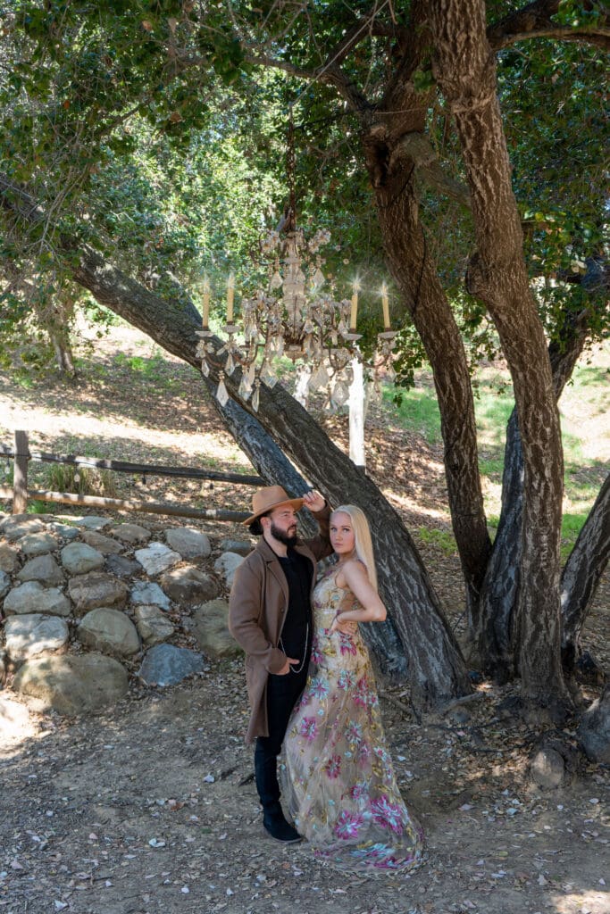 Engagement shoot with bride and groom in Malibu Mountains with her Claire Pettibone Shangri-La gown