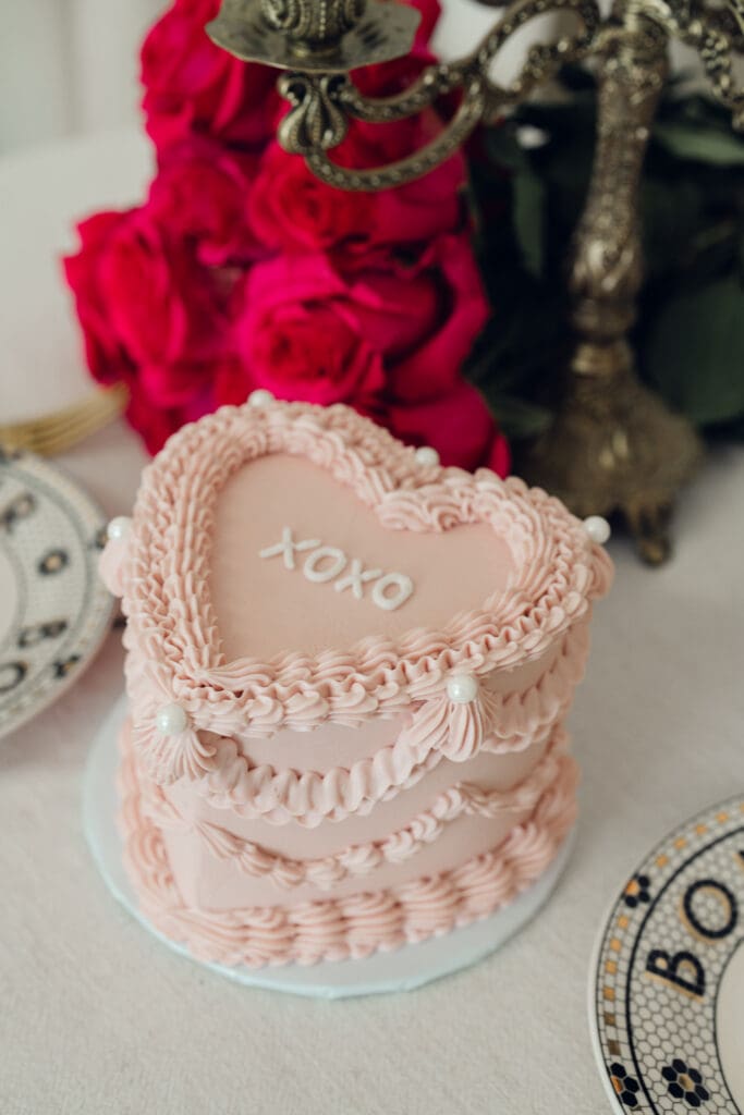 Vintage heart shaped Valentine’s cake styled on table during romantic mini session at LA Loft Studios in Los Angeles.